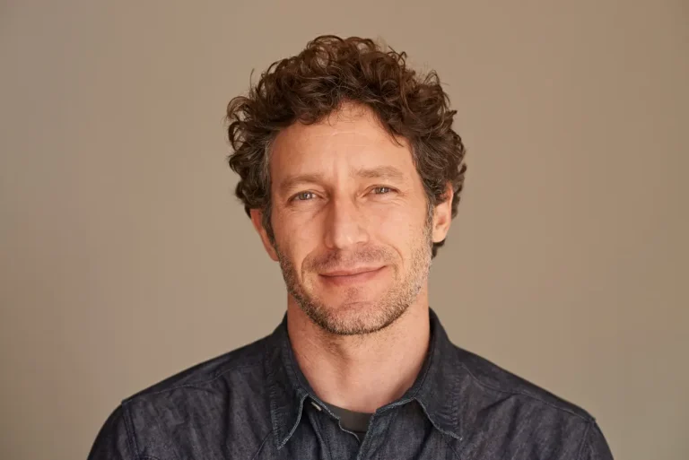A doctor providing anti-aging tips for men over 40 during a consultation, emphasizing health and vitality through personalized care
