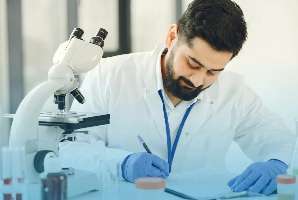 Licensed medical provider reviewing lab results to prescribe testosterone replacement therapy (TRT)