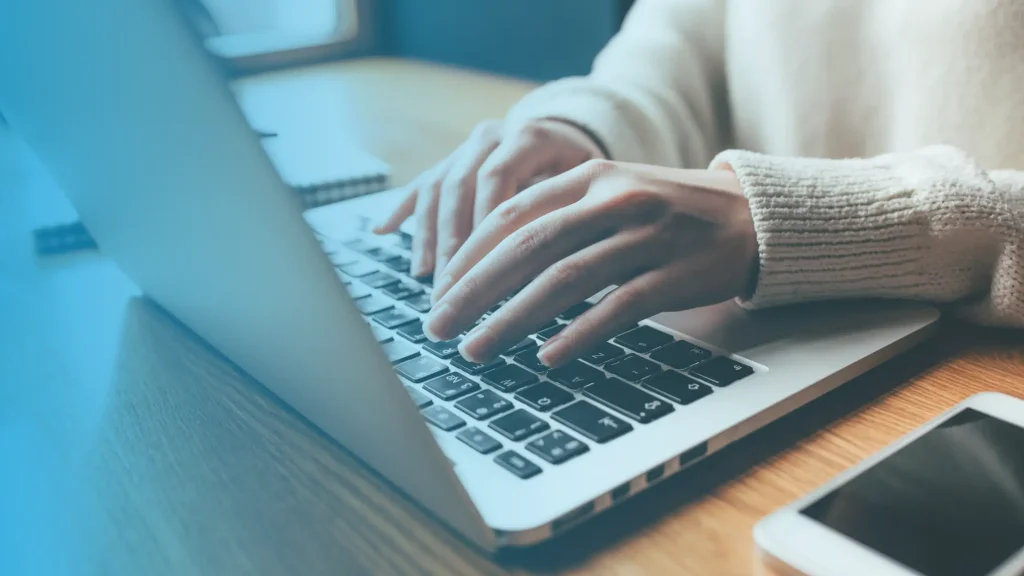 Person using a laptop to buy semaglutide online through a licensed telehealth weight loss clinic in the USA