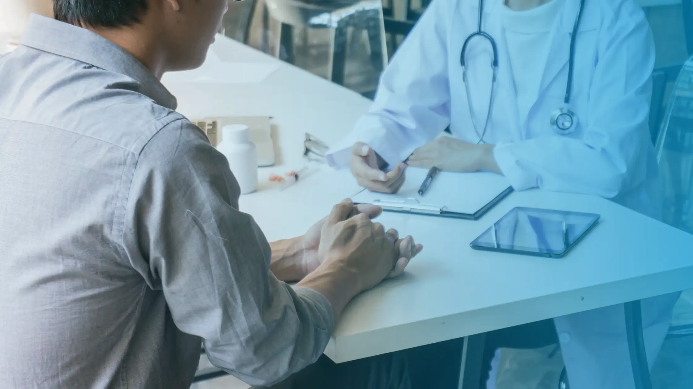 Patient discussing low testosterone symptoms with a doctor during a medical consultation