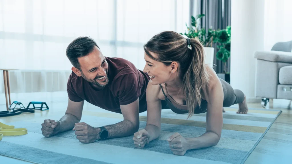 Healthy couple exercising at home showing improved energy and immunity supported by Thymosin Alpha 1 peptide therapy