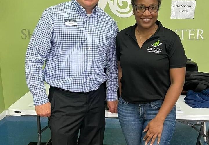Volunteers at a U&OJAX outreach event