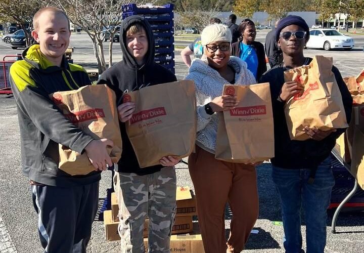 Volunteers at a U&OJAX community outreach event